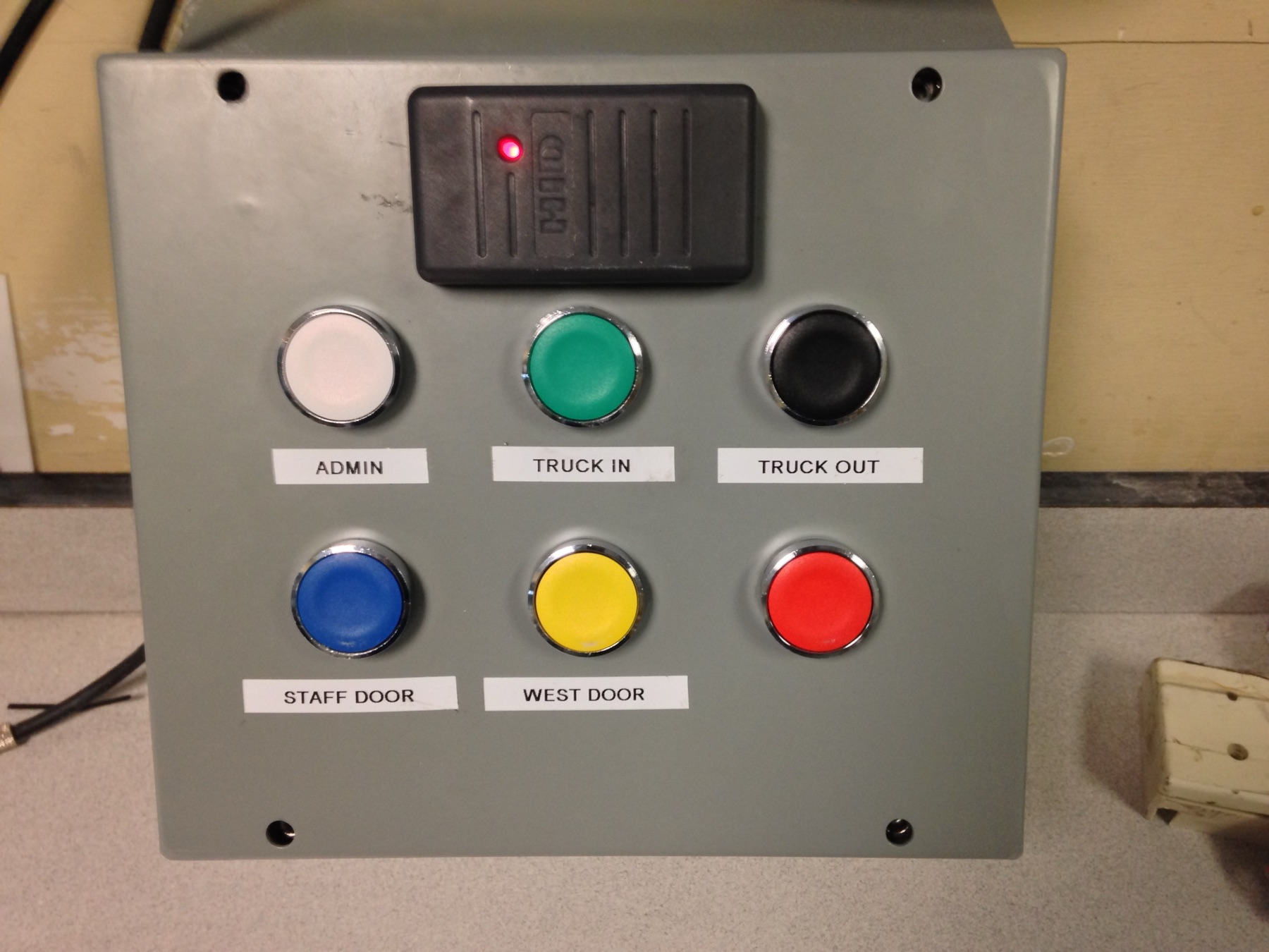 HID reader and colour-coded gate and door pushbuttons.
