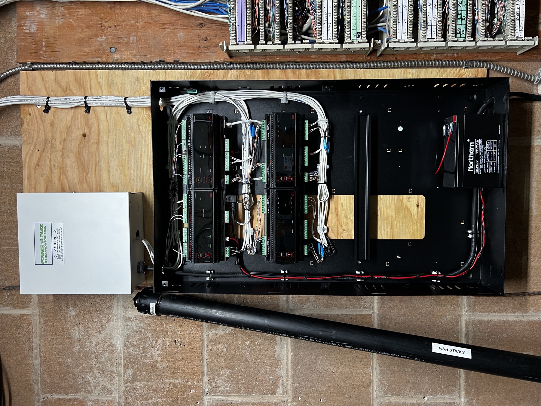 Access-control panel with ICT controllers and a power supply.